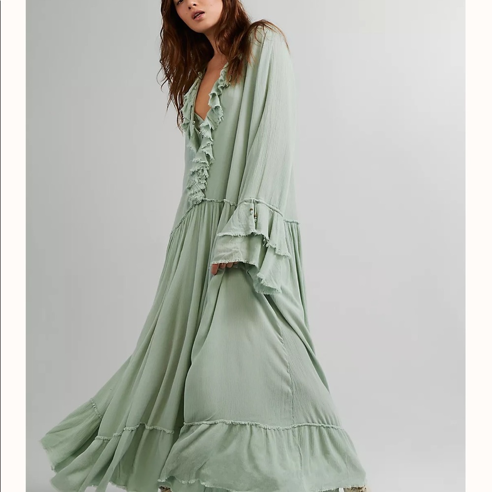 Free people dress NWT runs big small.mint color